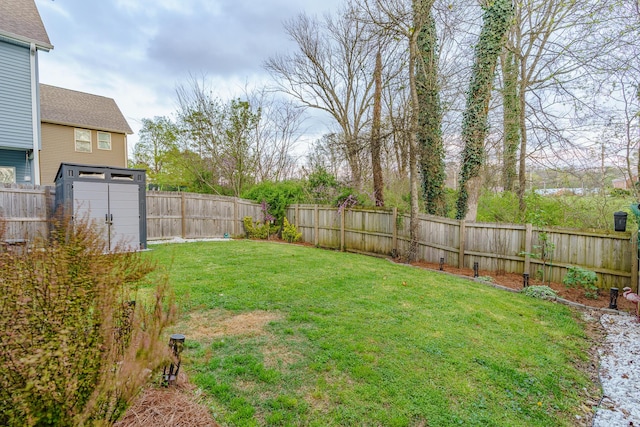 view of yard featuring an outbuilding and a storage shed