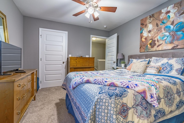 bedroom featuring light colored carpet and a ceiling fan