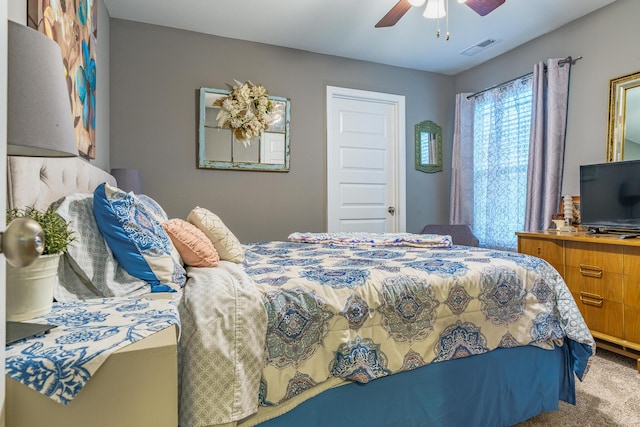 carpeted bedroom with a ceiling fan