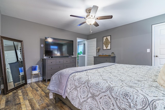 bedroom featuring dark wood-style flooring, baseboards, and ceiling fan