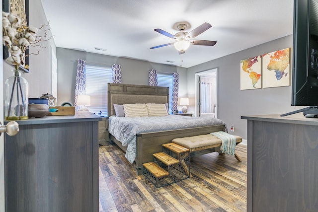 bedroom featuring dark wood-style flooring and ceiling fan