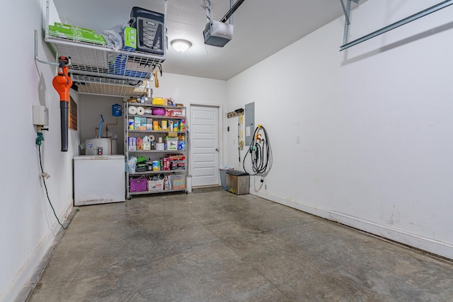 garage with a garage door opener and electric panel