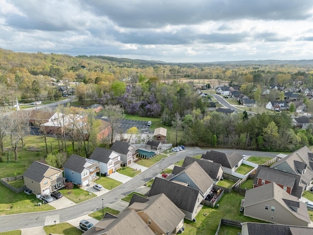 aerial view of residential area with a heavily wooded area