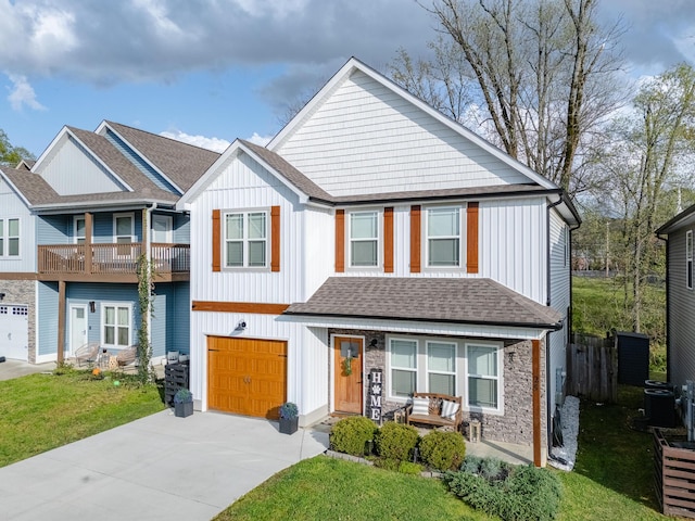 view of front of home featuring a garage, stone siding, concrete driveway, a porch, and central AC unit