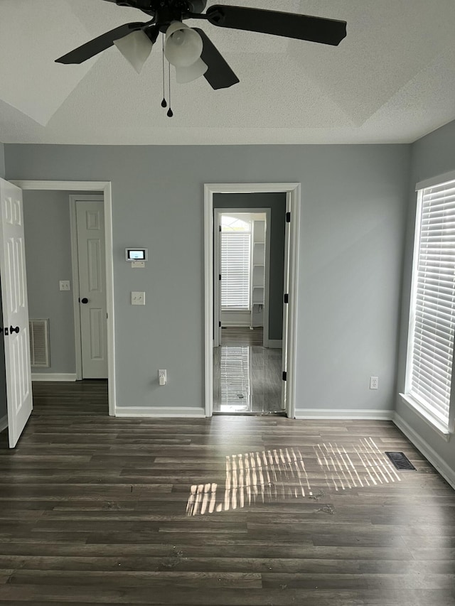 unfurnished bedroom with visible vents and multiple windows