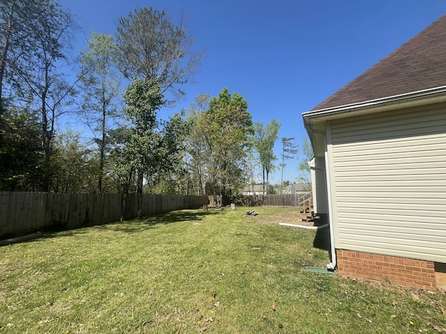 view of yard with a fenced backyard