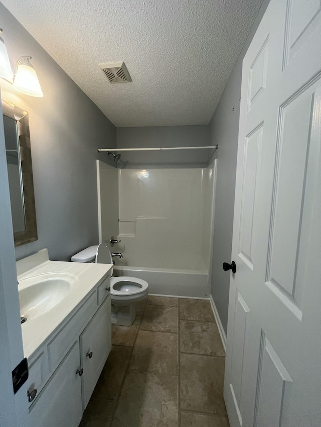 full bath featuring a textured ceiling, visible vents, vanity, toilet, and tub / shower combination