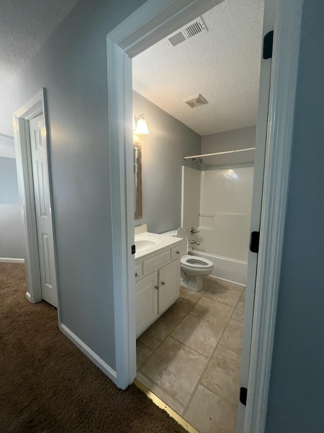 bathroom with shower / tub combination, vanity, toilet, a textured ceiling, and visible vents