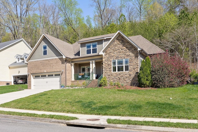 craftsman house featuring stone siding, a garage, concrete driveway, a front lawn, and covered porch