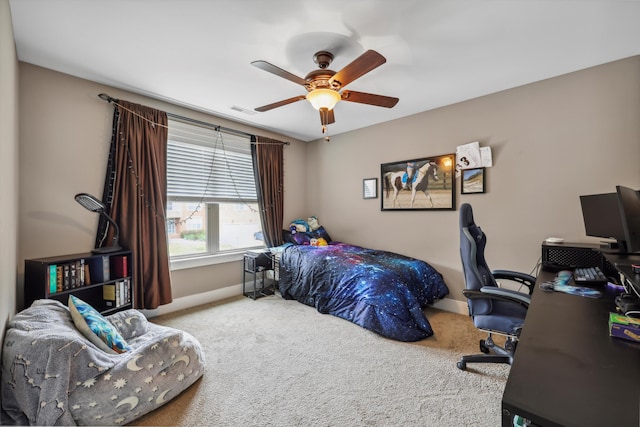 carpeted bedroom with baseboards, visible vents, and ceiling fan
