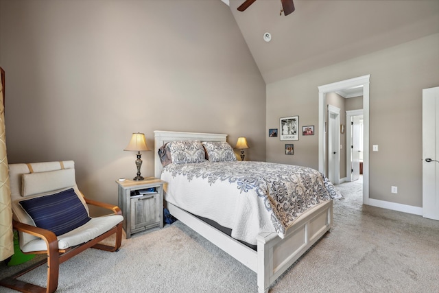 bedroom featuring high vaulted ceiling, baseboards, light colored carpet, and ceiling fan