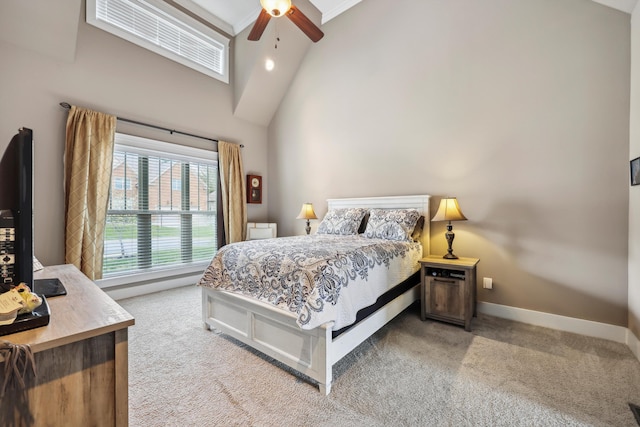 bedroom featuring baseboards, high vaulted ceiling, a ceiling fan, and light carpet