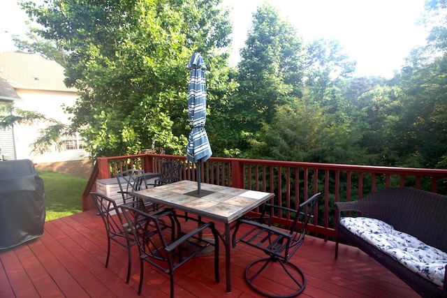 5553 Jonquil Ln, Ooltewah, TN 37363 - wooden deck with outdoor dining space and area for grilling