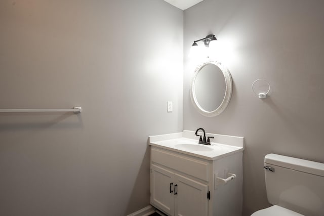 half bath with toilet and vanity