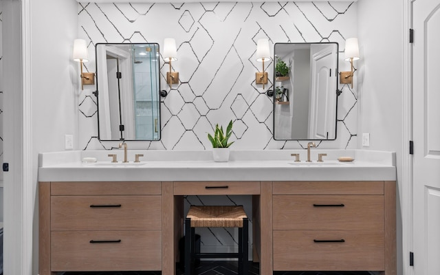 full bath featuring a sink, walk in shower, and double vanity