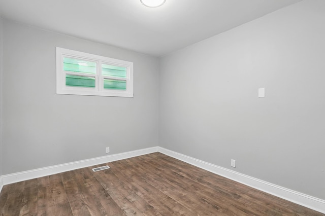5503 Oleary St, Chattanooga, TN 37410 - spare room featuring visible vents, dark wood-style flooring, and baseboards