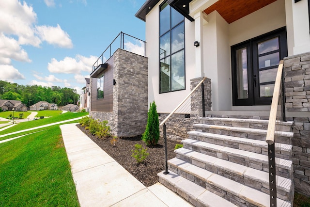 3354 Hawks Creek Dr, Apison, TN 37302 - view of exterior entry featuring stucco siding, french doors, a yard, and stone siding