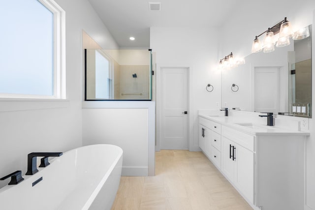 3354 Hawks Creek Dr, Apison, TN 37302 - full bath with a freestanding bath, double vanity, a tile shower, and recessed lighting