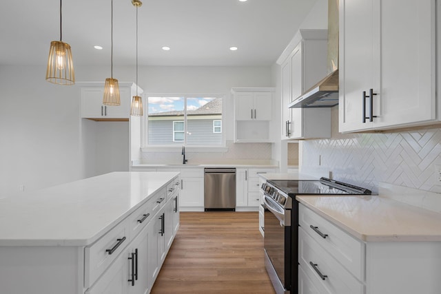 3354 Hawks Creek Dr, Apison, TN 37302 - kitchen with appliances with stainless steel finishes, wall chimney exhaust hood, light wood-type flooring, recessed lighting, and backsplash