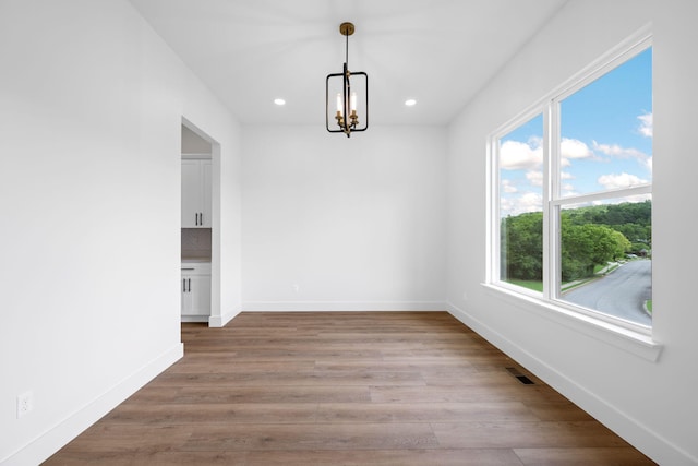 3354 Hawks Creek Dr, Apison, TN 37302 - unfurnished dining area featuring a chandelier, recessed lighting, and wood finished floors