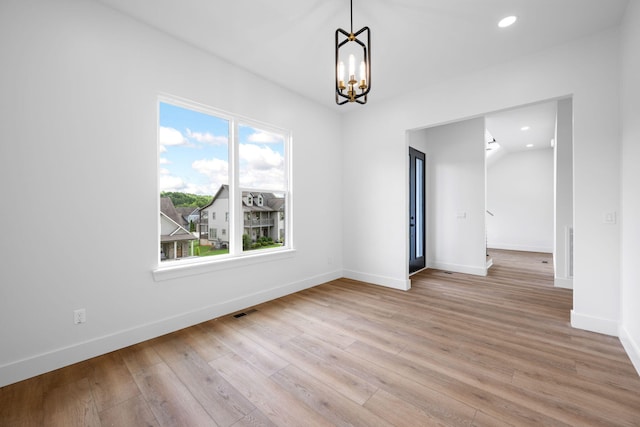 3354 Hawks Creek Dr, Apison, TN 37302 - empty room with a chandelier, light wood-style flooring, and recessed lighting