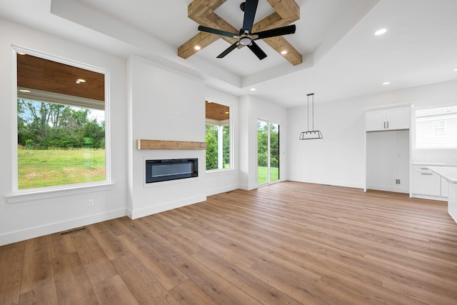 3354 Hawks Creek Dr, Apison, TN 37302 - unfurnished living room featuring a glass covered fireplace, ceiling fan, light wood-style floors, and recessed lighting