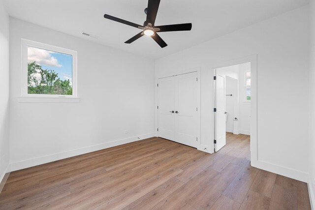 3354 Hawks Creek Dr, Apison, TN 37302 - unfurnished bedroom with light wood-type flooring, a closet, and ceiling fan