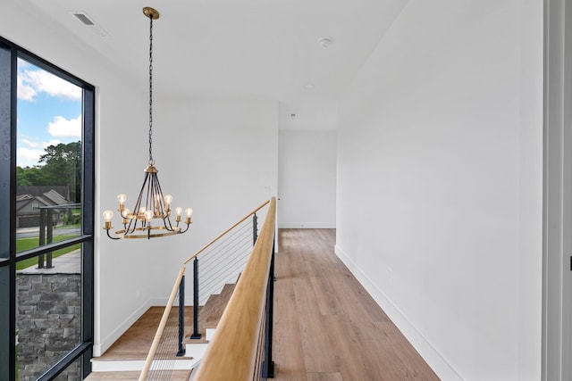 3354 Hawks Creek Dr, Apison, TN 37302 - hallway featuring a chandelier and light wood-type flooring