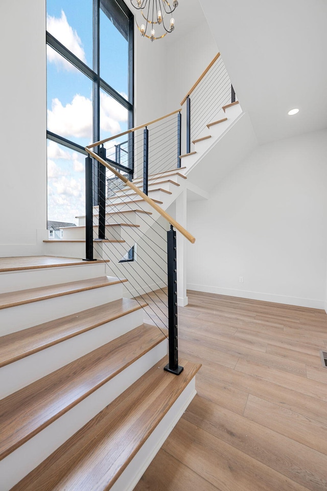 3354 Hawks Creek Dr, Apison, TN 37302 - stairway featuring a chandelier, wood finished floors, and recessed lighting