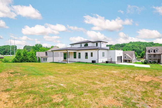 3354 Hawks Creek Dr, Apison, TN 37302 - rear view of property featuring a yard, a patio area, and an attached garage