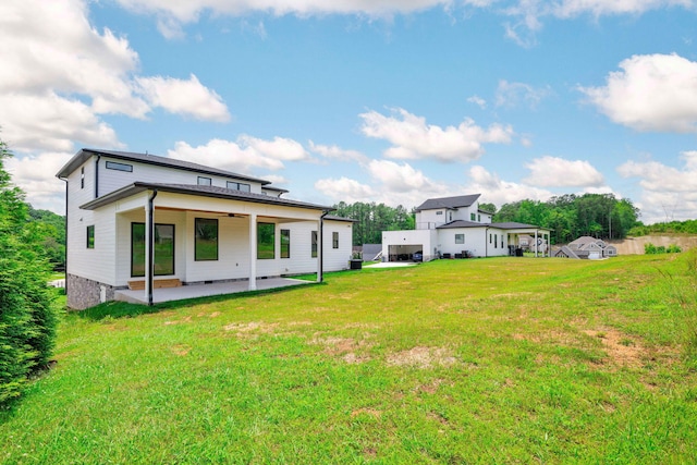 3354 Hawks Creek Dr, Apison, TN 37302 - rear view of property with a patio area and a lawn