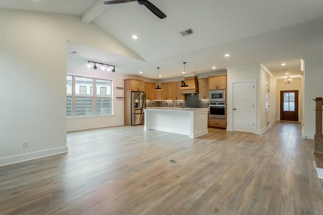 5735 Acadia Dr, Chattanooga, TN 37415 - kitchen with tasteful backsplash, visible vents, open floor plan, appliances with stainless steel finishes, and light wood finished floors