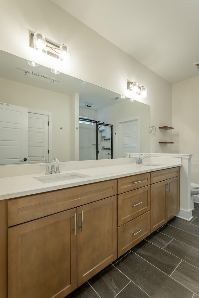5735 Acadia Dr, Chattanooga, TN 37415 - full bath featuring a shower stall, double vanity, a sink, and toilet
