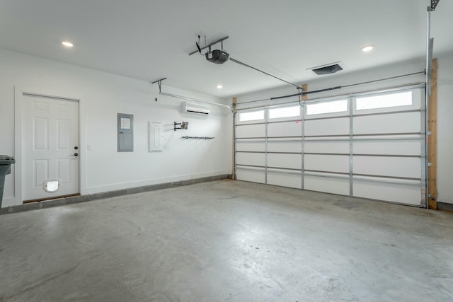 5735 Acadia Dr, Chattanooga, TN 37415 - garage with baseboards, electric panel, visible vents, a wall unit AC, and a garage door opener