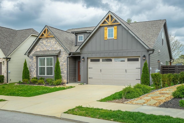 5735 Acadia Dr, Chattanooga, TN 37415 - craftsman-style home with board and batten siding, roof with shingles, stone siding, and concrete driveway