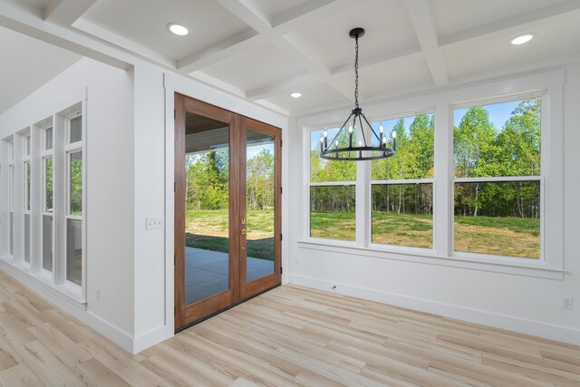 337 Hunter Trl, Trenton, GA 30752 - unfurnished dining area featuring light wood-type flooring, coffered ceiling, beamed ceiling, baseboards, and a notable chandelier