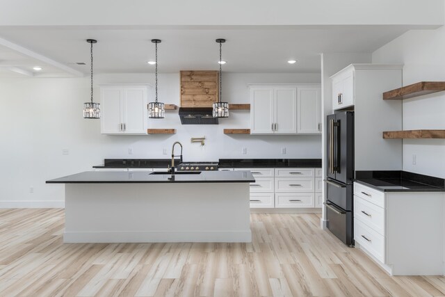 337 Hunter Trl, Trenton, GA 30752 - kitchen featuring dark countertops, open shelves, a sink, light wood-style floors, and high quality fridge