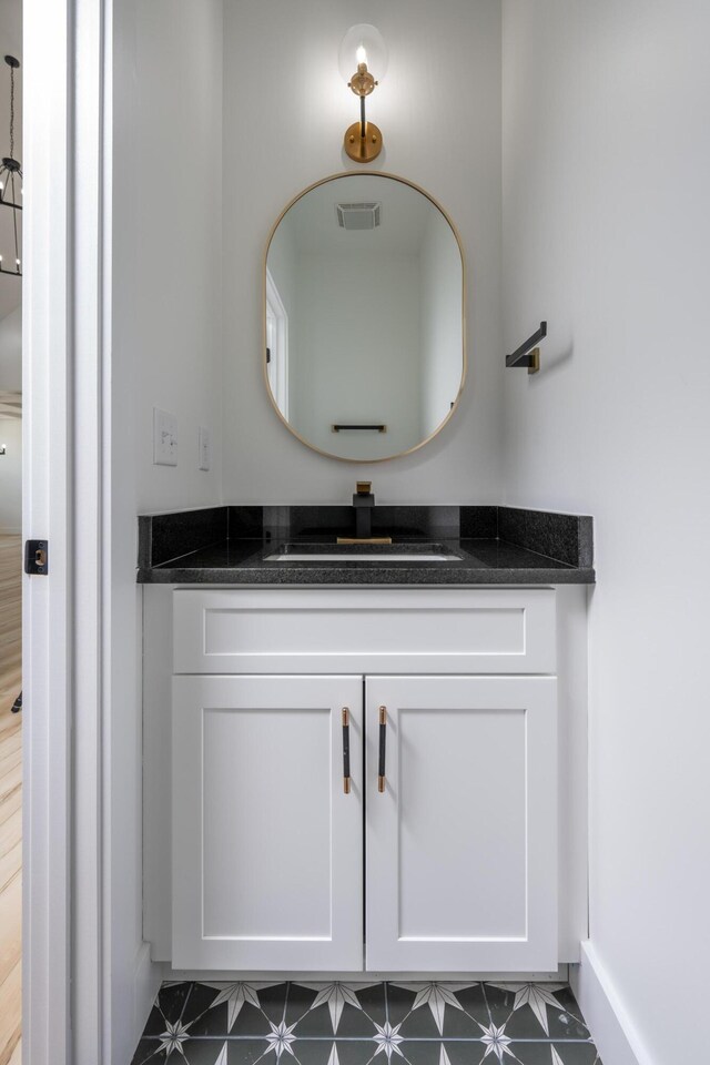 337 Hunter Trl, Trenton, GA 30752 - bathroom featuring baseboards, vanity, and visible vents