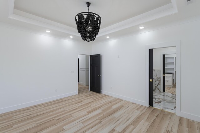 337 Hunter Trl, Trenton, GA 30752 - unfurnished bedroom with recessed lighting, a raised ceiling, light wood-style floors, and a chandelier