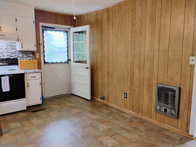 kitchen with electric range, heating unit, white cabinetry, and under cabinet range hood