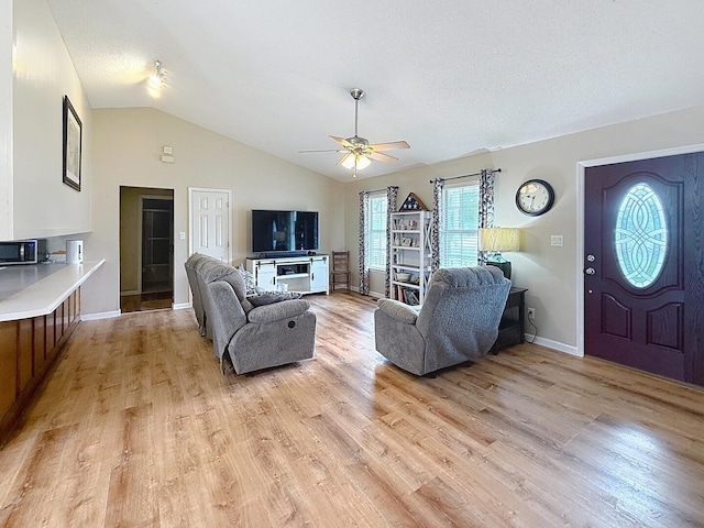 1319 Jacobs Ave, Bridgeport, AL 35740 - living area with ceiling fan, baseboards, and light wood finished floors