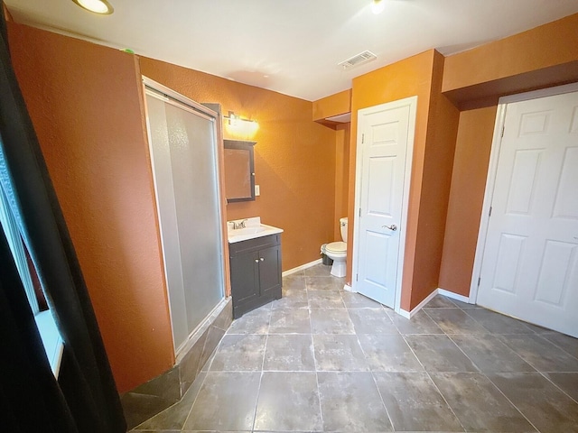 1319 Jacobs Ave, Bridgeport, AL 35740 - bathroom featuring a shower stall, tile patterned flooring, visible vents, toilet, and vanity