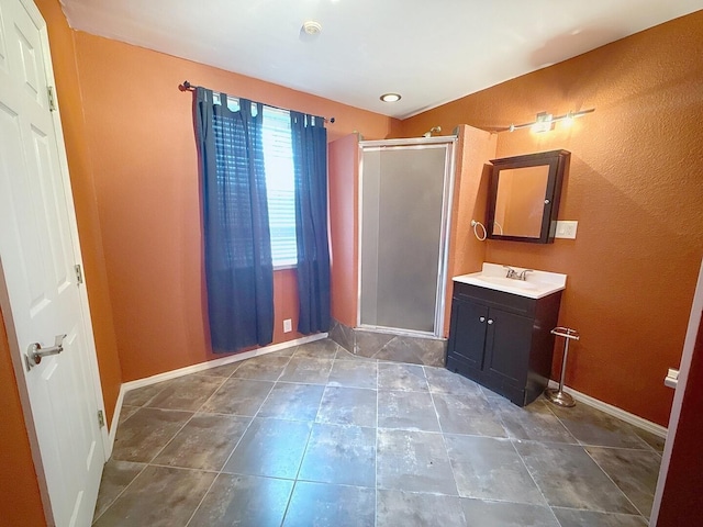 1319 Jacobs Ave, Bridgeport, AL 35740 - bathroom with a shower stall, baseboards, vanity, and tile patterned floors