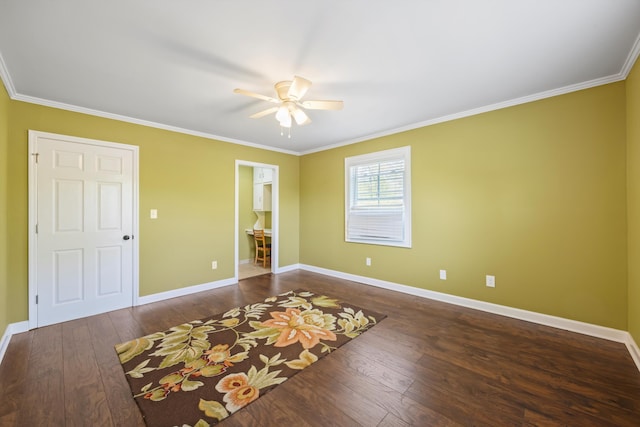 interior space with crown molding, wood-type flooring, baseboards, and ceiling fan