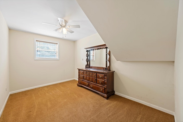carpeted bedroom featuring baseboards and ceiling fan