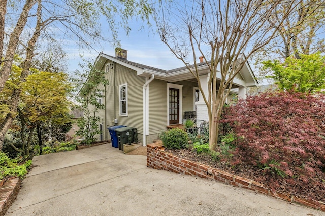 212 Jarnigan Ave, Chattanooga, TN 37405 - view of side of property featuring covered porch and a chimney