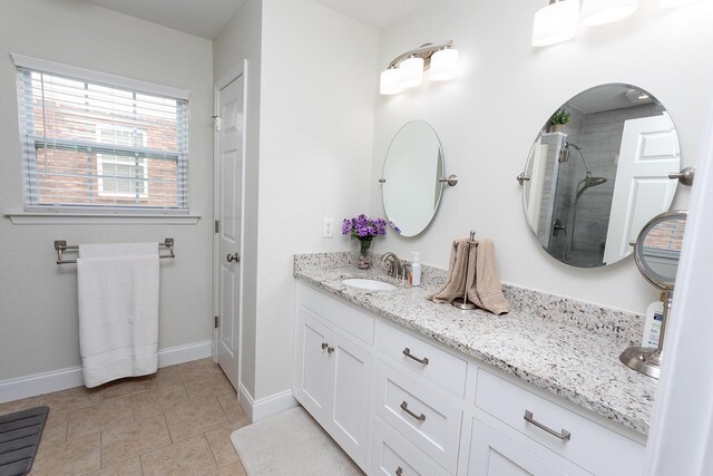 1903 Applebrook Dr, Rossville, GA 30741 - full bath featuring tile patterned flooring, vanity, baseboards, and tiled shower