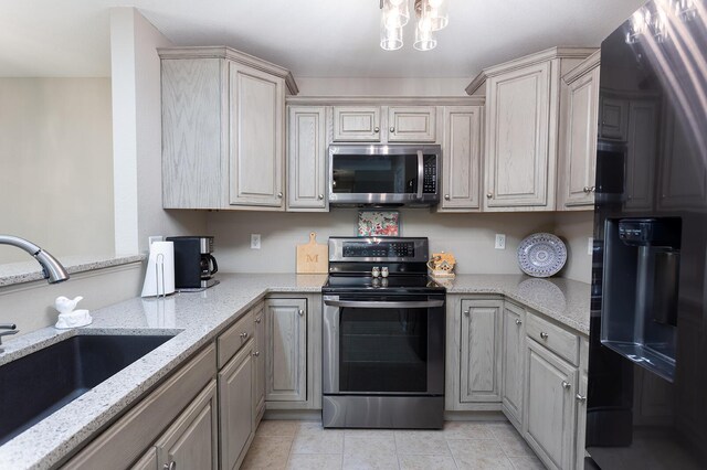 1903 Applebrook Dr, Rossville, GA 30741 - kitchen with light tile patterned flooring, light stone counters, a sink, and stainless steel appliances