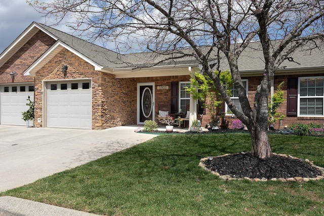 1903 Applebrook Dr, Rossville, GA 30741 - single story home with concrete driveway, stone siding, a front lawn, a garage, and a shingled roof