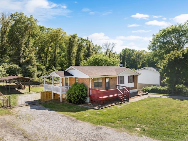 9027 Wooten Rd, Chattanooga, TN 37416 - ranch-style home with a gate, a shingled roof, fence, a front yard, and brick siding